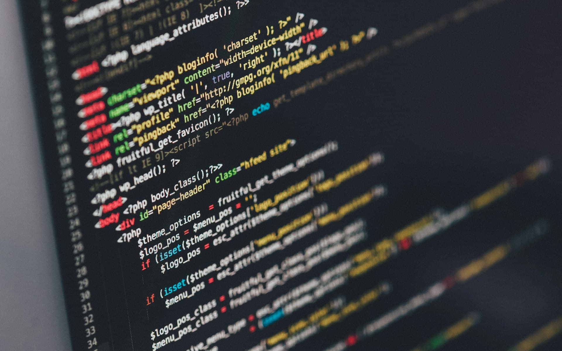 Source code on a monitor in a darkened room