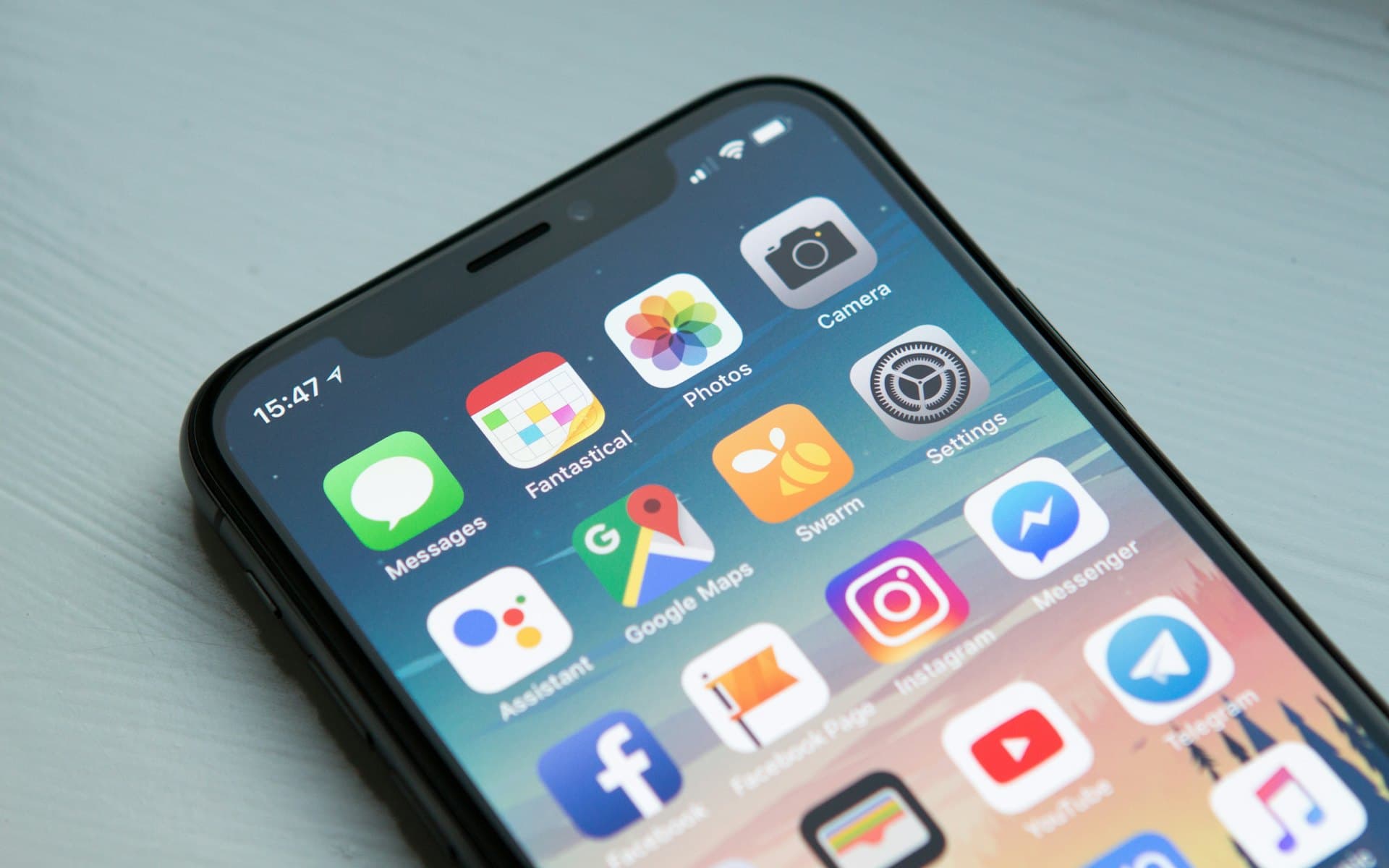 A smartphone home screen full of application icons