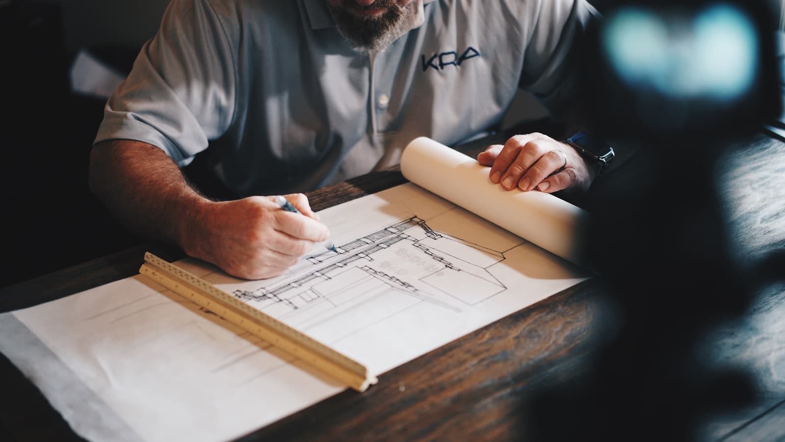 An architect marking up a set of construction drawings